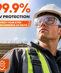 Tough As Nails Safety Glasses Designed To Fit Snug Over Eyeglasses Without Pinching Featuring Z Eighty Seven Impact Rating And Superior Anti Fog Coating For Long Shifts worn by a worker on a construction site.