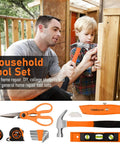 Adult and child using household tool set for repairs, featuring scissors, hammer, tape measure, level, and utility knife.