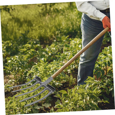 Gardener using Sturdy Steel Fork For Soil Aeration And Cultivation, Heavy Duty Garden Tool For Fields And Flower Beds in a vegetable patch