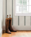 Black Fabric Stripe Wallpaper With Woven Look Prepasted And Washable Strippable Finish in room setting with boots