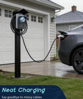 Heavy Duty Outdoor EV Charger Pedestal With Weather Shield Roof For Tesla Wall Connector And J1772 Level 2 Stations, shown in the rain.