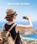 Person using Brave 4 Pro Action Camera Bundle With Waterproof Floating Grip And Accessory Kit, displaying dual color screens.