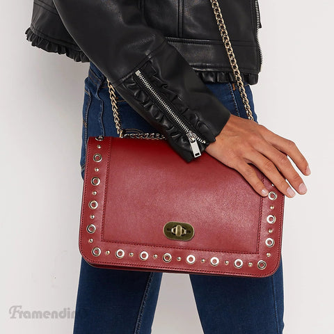 Framendino red leather crossbody bag with gold-tone turn-lock clasp, studded edges, and chain strap