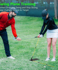 Instructor guiding golfer with Golf Alignment Sticks Set For Aiming, Putting, And Full Swing Training, Game Changer For Posture And Shoulder Alignment.