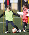 Kids play soccer with Six Piece 5 Foot Agility Poles For Soccer Basketball Football And More Pro Grade Speed And Footwork Training Sticks