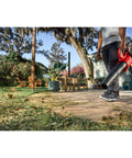 Man using Cordless Leaf Blower With Battery And Charger V20 For Quick Yard Cleanup Up To 110 MPH Air Speed Lightweight Handheld