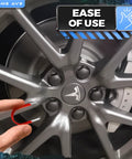Using Three Piece Lug Nut Cap Cover And Center Cap Removal Tool Set With Stainless Steel Plastic ABS And Steel Pullers For Audi BMW Mercedes Mini Tesla VW Cars on a Tesla wheel.