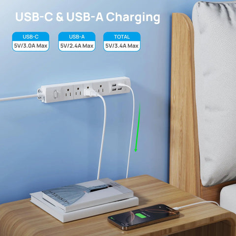 Ultra Thin Surge Protector Power Strip With USB A And USB C Flat Plug 6ft Cord Four AC Outlets 1440J shown bedside