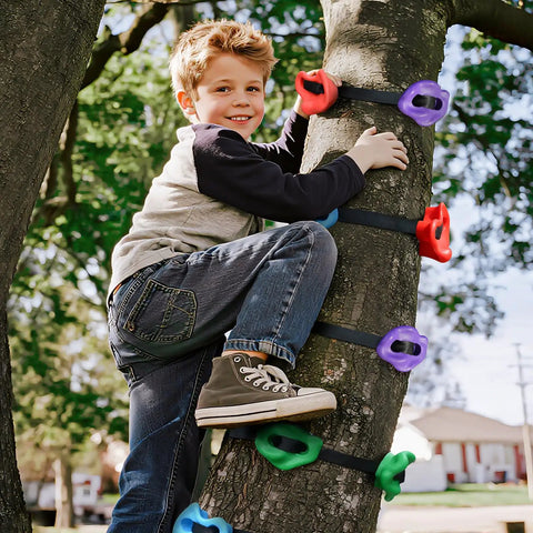 Child using Ninja Tree Climbing Holds Set For Kids And Grownups on tree, showing colorful resin rocks and straps outdoors.