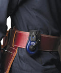 Professional Grade Hella Durable Mini Chalk Line Tool featuring heavy duty aluminum housing, attached to a tool belt.