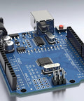 Close-up of Arduino Compatible ATmega328P Microcontroller Board With USB Cable For Beginners And Pros showing 14 digital I/O pins.
