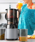 Woman using Super Dope 130Mm Wide Chute Masticating Cold Press Juicer For All Fruits Veggies 250W, enjoying fresh juice.