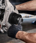 Mechanic using master wheel hub and bearing remover and installer kit for front wheel drive vehicles with nine step sleeves and washers.