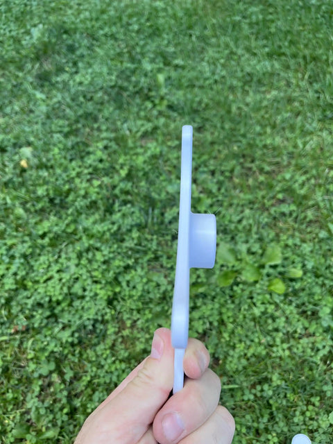 Side view of end connector from Adjustable Dog Agility Cavaletti Jump Set Of 4 For Backyard Training And Rehab on grass field.