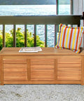 Acacia Wood Deck Box Bench 47 Gallon Outdoor Storage Chest With Seating on balcony with pillow and magazine on top