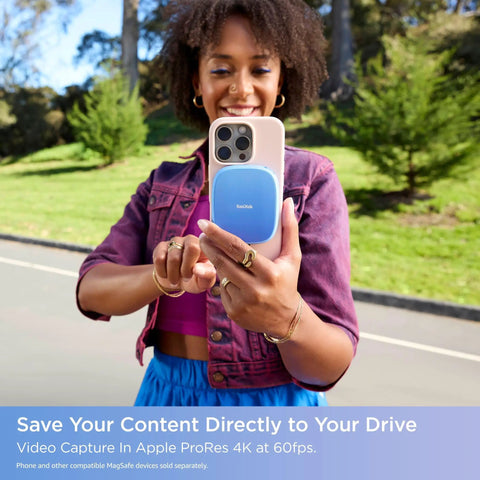 Person using 2TB Creator Phone SSD with ProRes speed on iPhone 15 Pro Max for mobile content creation, MagSafe attachment visible.