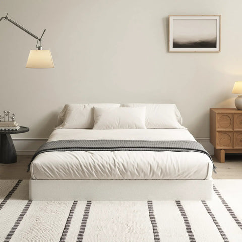 Badass Durability Seven Inch Queen Box Spring With Heavy Duty Steel Frame And Tear Resistant Fabric Cover in a modern bedroom setting.