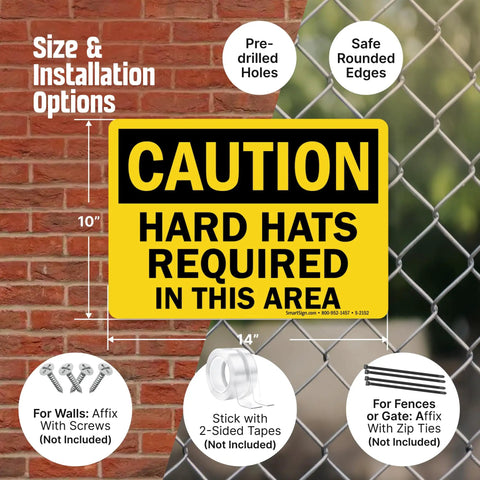 Caution Hard Hats Required In This Area Sign 10 By 14 Inch Aluminum Black On Yellow Durable Outdoor Safety Sign With Four Corner Mount Holes For Easy Installation Jobsite Safety Sign shown on a fence grid.