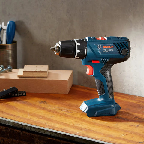 Real Deal 18V Cordless Drill Driver With 55Nm Torque And Quick Release Chuck on a wooden workbench, close-up view.