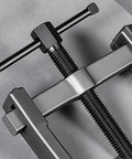 Heavy Duty Adjustable Bearing Puller And Two Jaw Gear Splitter Crafted From Solid Carbon Steel with visible screws and clamps.