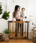 Oak Wood And Metal Baby And Pet Gate For 36 To 60 Inch Openings, 30 Inch Tall, No Drill Pressure Mount shown in doorway