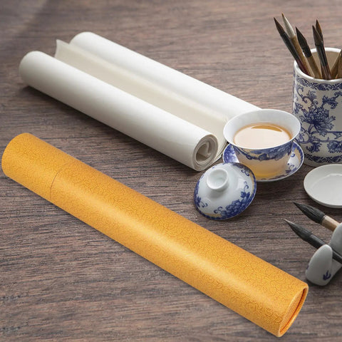 Portable Yellow Poster Storage Tube With Waterproof Round Design next to art supplies and tea set on wooden table