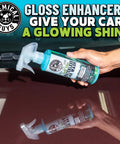 Swift Wipe Waterless Car Wash Spray With High Lubrication Formula, No Water Needed, Wipe And Shine On The Go, Safe For All Finishes, Streak Free Finish, Safe For Clear Coat And Chrome, Great For Daily Detailing, 1 Gallon bottle held over a car hood