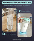 The Go To Rock Solid Borosilicate Glass Breast Milk Pitcher With 32 Oz and Upgraded BPA Free Mixing Spoon in use with hot water.
