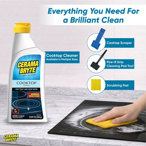 Glass Cooktop And Stove Top Cleaner Kit With Scraper, Razor, And Pad in use on black cooktop, showing a person's hand cleaning.