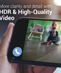 Smartphone displaying Indoor Home Security Camera With 360 Degree Pan, 1080P HDR, color night vision showing baby in room
