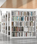 Beefy Metal Five Tier Adjustable Book Shelf In White, 68.9 Inches High by 36 Inches Wide, filled with books in a modern room.