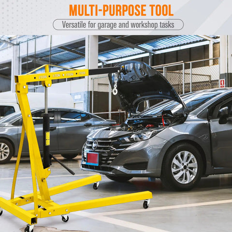 Heavy Duty Folding Engine Hoist With Adjustable Telescopic Boom Two Ton Cherry Picker for Garage Workshop in use.