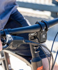 Suspension Stem For Bicycle Handlebar With Adjustable Shock Absorption in use on a bike, boosting comfort with a 50 degree high rise.