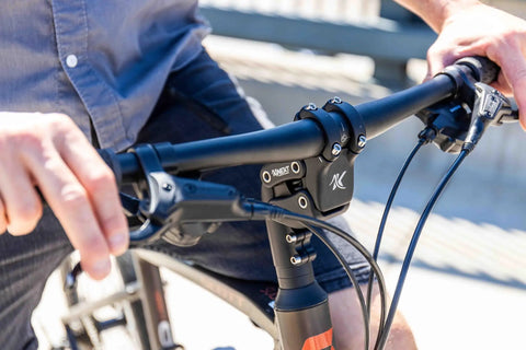 Suspension Stem For Bicycle Handlebar With Adjustable Shock Absorption in use on a bike, boosting comfort with a 50 degree high rise.