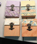 Five Piece Set Of Retro Antique Bronze Heart Shaped Box Hasp Lock Latches Featuring Tough As Nails Zinc Alloy Construction And Smooth Brass Plating To Keep Your Jewelry Boxes Solid And Fade Free Always, displayed on colorful boxes.