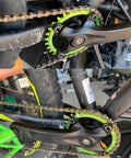 Close-up of 104 BCD Mountain Bike Chainring 34T Green, Four Bolt Alloy MTB Round, fitted on a bike, tough for 9-11 speed shifting.