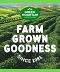 Green Mountain coffee farm with lush fields under text stating 'Farm Grown Goodness Since 1981'.