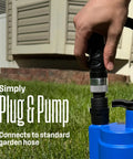 Person connecting a hose to a 1/4 HP Submersible Sump Pump, 25 GPM High Flow Water Removal, Portable Thermoplastic Utility Pump in a garden.