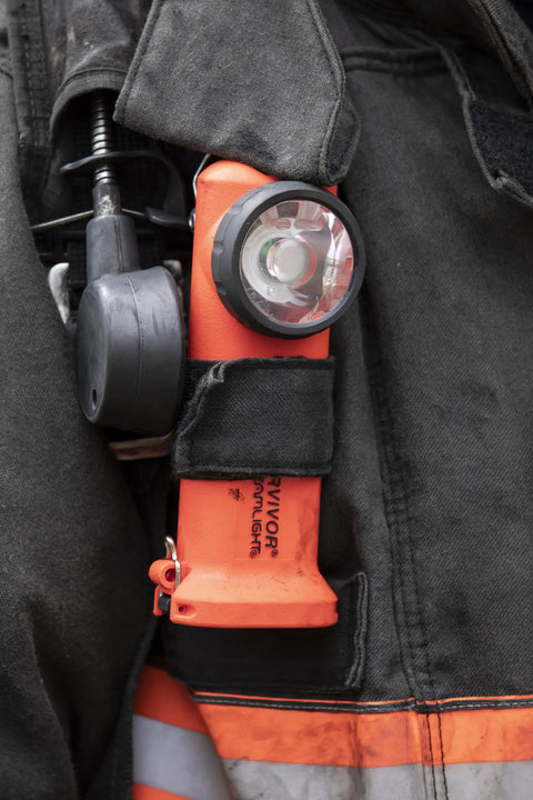 Survivor 175-Lumen Rechargeable Firefighter Right Angle Flashlight Intrinsically Safe Safety-Rated Orange on turnout gear.