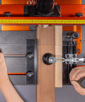 Pro Grade Rail Coping Sled Router Table Jig for Cabinet Doors in use showing secure clamping on phenolic base for precise joinery.
