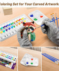 Person painting wooden raccoon with paintbrushes and paints from All-In-One Wood Carving Kit For Beginners with gloves.