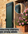 Heavy Duty Steel Blind Shutter Hinges 8 Pack With S Holdback Hook 1-1/16 Inch Black Powder Coat exterior window shutters secured to stone wall.