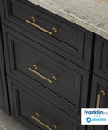 Champagne Bronze Cabinet Handles 5 Pack, 4 Inch Center To Center Drawer Pulls on dark cabinetry, kitchen installation view.