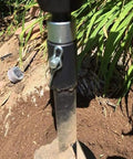 Earth Auger Drill Bit Adapter For Electric Drills One To Three Converter in use in garden soil