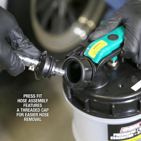 Close-up of Dual Mode Garage-Grade Fluid Extractor Pump 1.5 Gallon with dipstick adapters and hose assembly for auto maintenance.