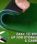 Indoor Outdoor Putting Green Mat That Feels Like Real Turf Pro Grade Non Slip Practice Turf being rolled for storage