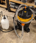 Clear 1 Inch High Pressure Hose With Spiral Steel Wire Reinforcement, 10 Ft Long, connected to shop vacuum and water pump