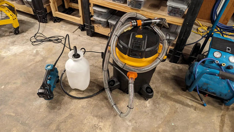 Clear 1 Inch High Pressure Hose With Spiral Steel Wire Reinforcement, 10 Ft Long, connected to shop vacuum and water pump