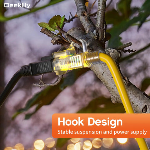 Tough As Nails 50 Foot Outdoor Extension Cord With Lighted End Yellow 12 Gauge Waterproof, suspended on a tree branch