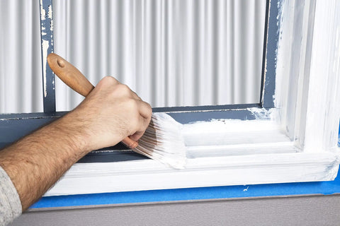 Hand painting window frame with Stop Peeling Paint With Triple Thick High Build Binding Primer That Is Low VOC And Water Based Seals Weathered Surfaces Delivers Major Flex Loads A Smooth Finish And Dries White For A Slick Indoor Or Outdoor Makeover
